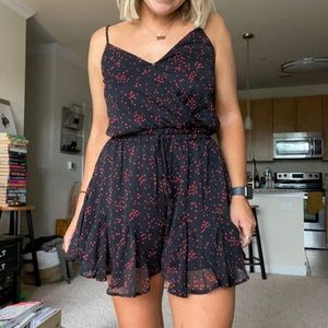 Francescas black romper with red squares M